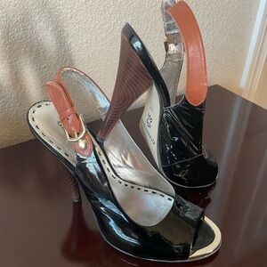 Unique style Black patent leather heels with brown/tan leather straps and heals